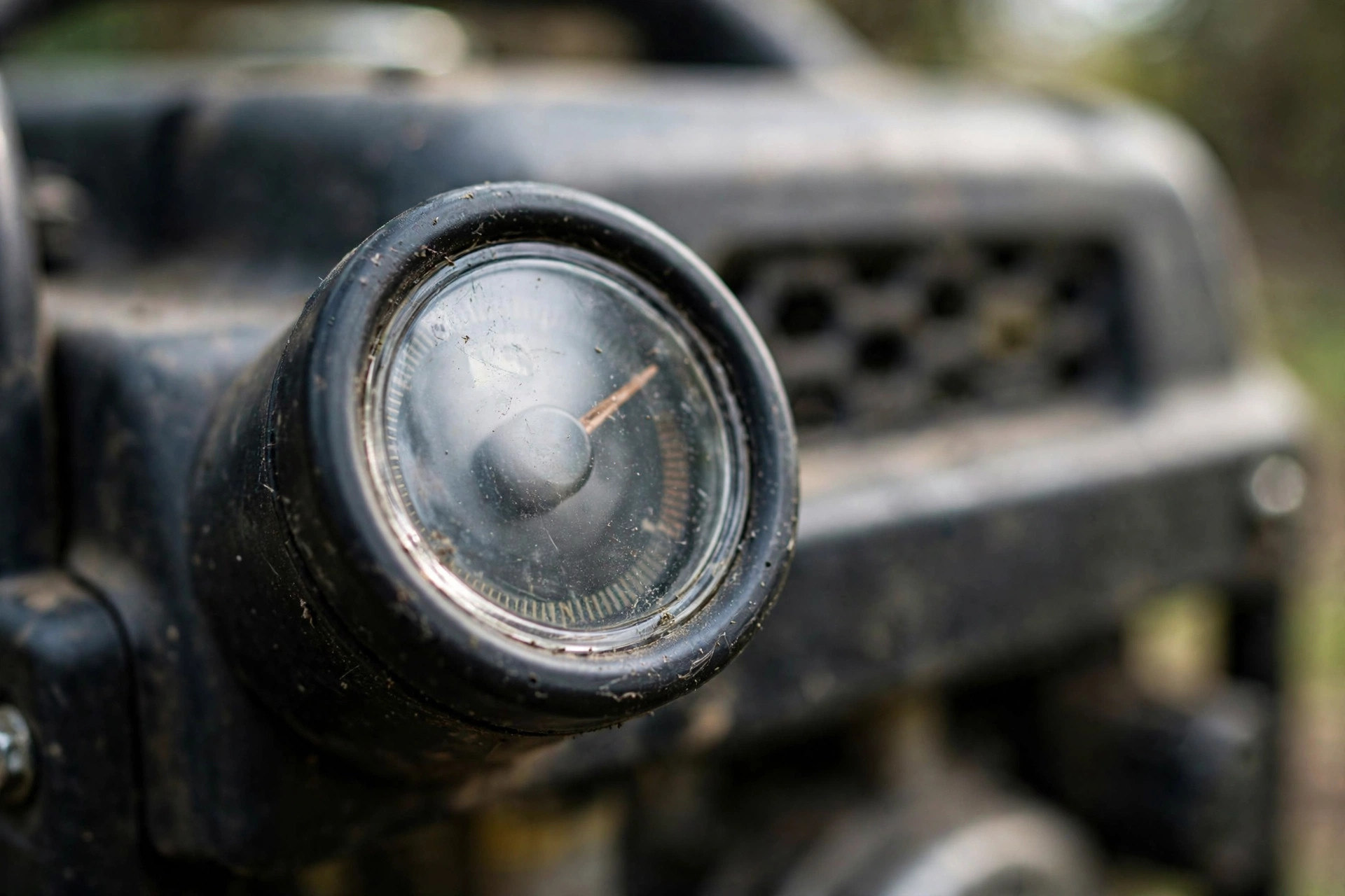 Close-up of a fuel gauge on a running portable generator.