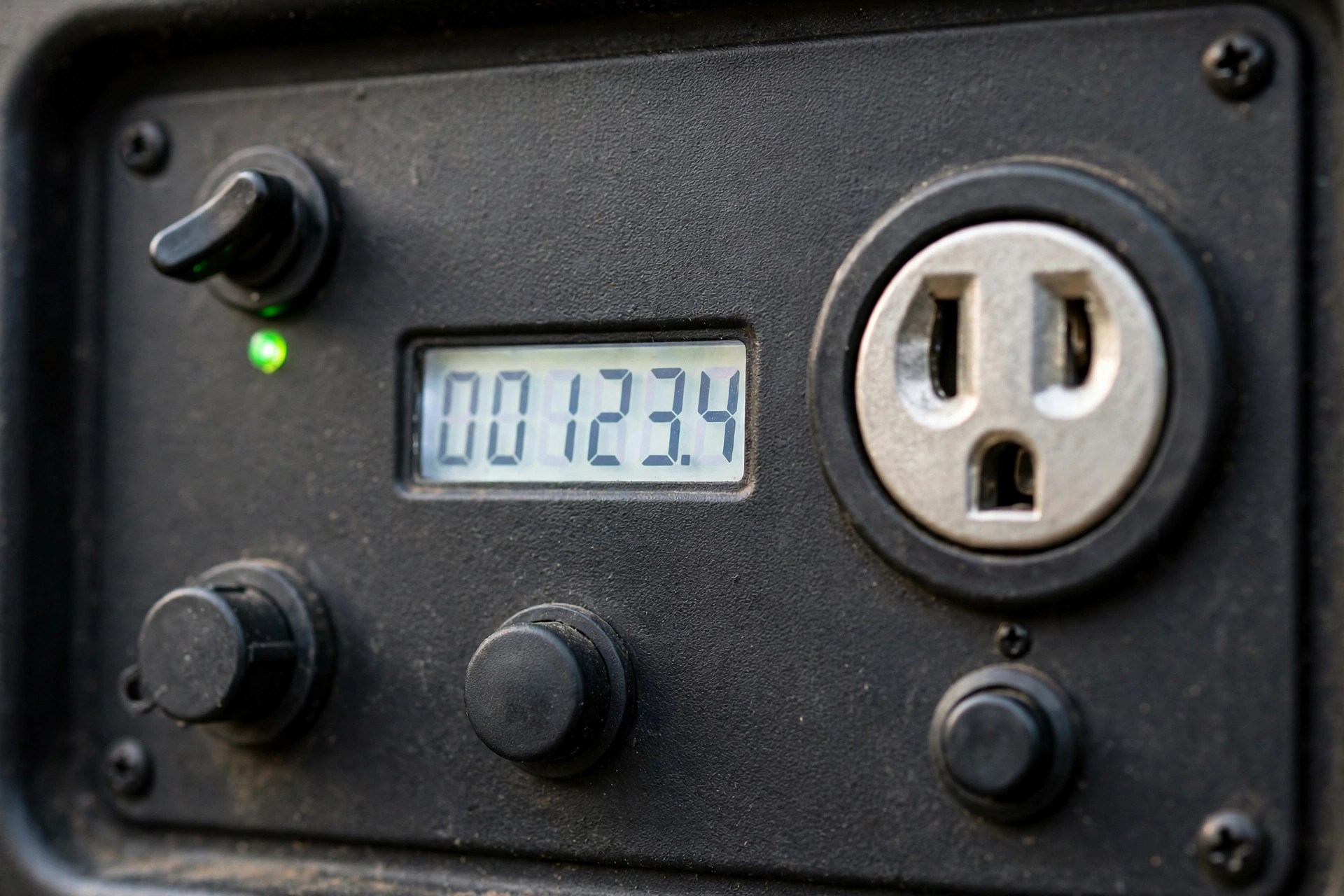 Realistic close-up of Honda EU7000iS control panel with Eco-Throttle switch, 30-amp twist-lock outlet and digital hour meter,