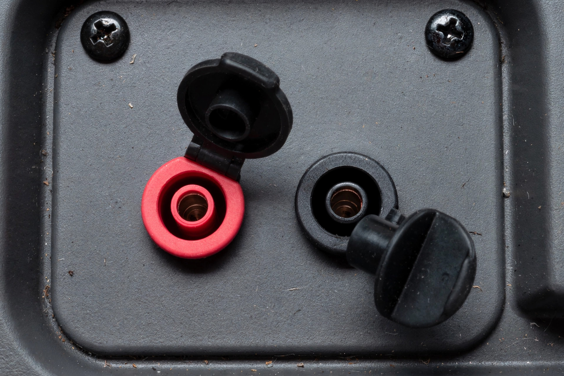Close-up realistic photo of parallel kit terminals on an inverter generator panel